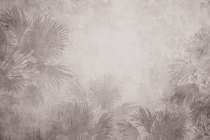 Fotobehang Exotische vegetatie op een betonnen achtergrond