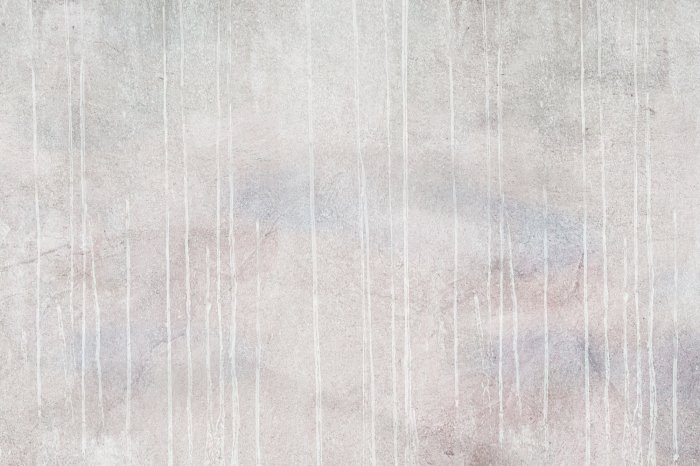 Fotobehang Verf die zachtjes over beton stroomt