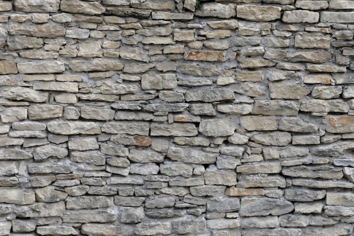 Fotobehang Grijsbeige stenen muur