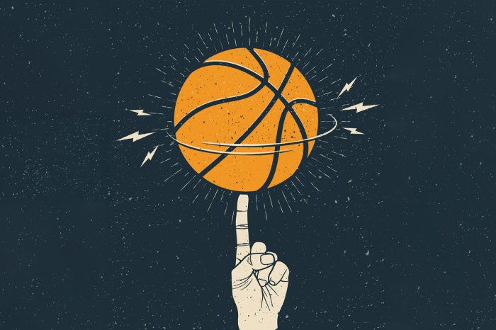 Fotobehang Een bal die ronddraait op de vinger van een atleet