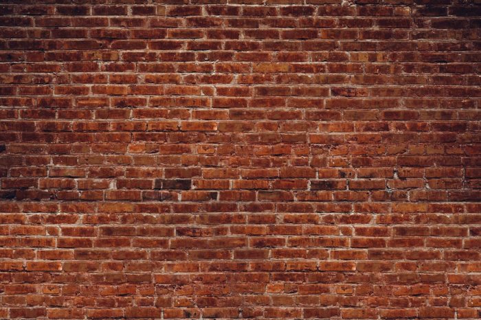 Fotobehang Rode bakstenen muur