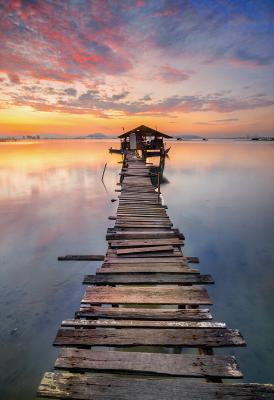 Sticker Houten steiger tegen de achtergrond van een zonsondergang
