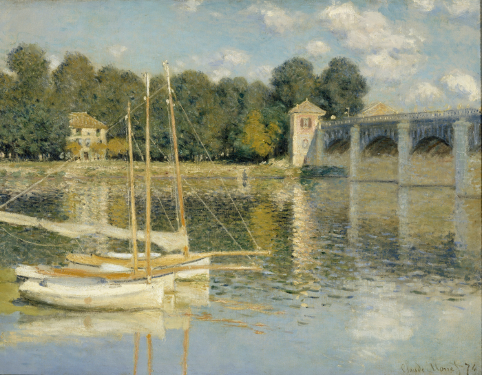 Canvas Pittoreske bootjes op de rivier met uitzicht op de historische brug