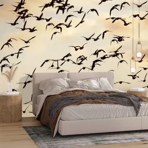 Fotobehang Een zwerm vogels tegen de lucht