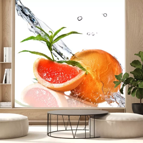 Sticker Water splash op grapefruit met munt geÃ ¯ soleerd op wit