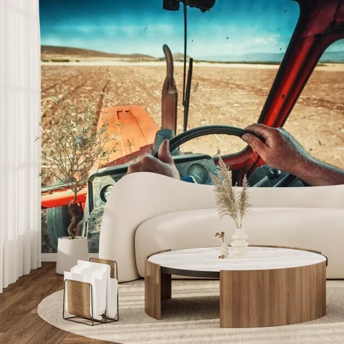 Fotobehang Close-up handen van de boer, zit binnen in de trekkerhut