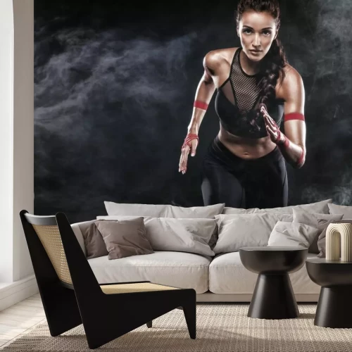 Fotobehang Een atletische vrouw die rent