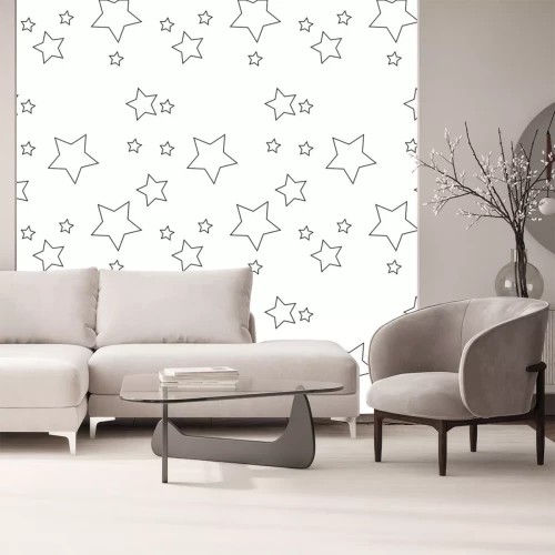 Sticker Naadloos vectorpatroon met gekleurde sterren van diverse grootte op witte achtergrond.