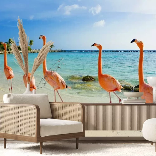 Fotobehang Flamingo's wandelen op het strand