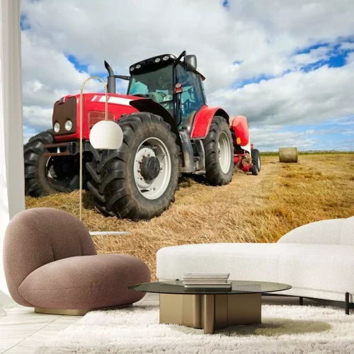 Fotobehang Trekker verzamelen hooiberg in het veld