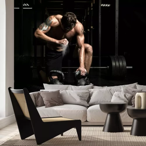 Fotobehang Gespierde man en krachttraining