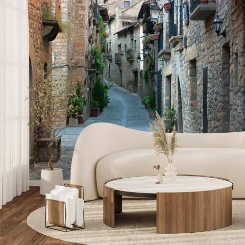 Fotobehang Een straat tussen oude stenen huizen