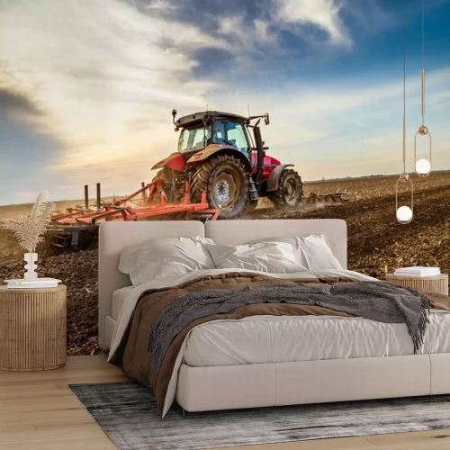 Fotobehang Trekker cultiveren veld in de lente