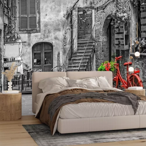 Fotobehang Een rode fiets op een straat in Toscane