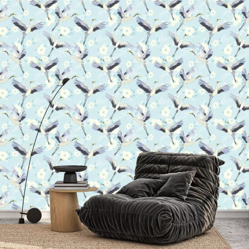 Behang Kranen tijdens de vlucht op een blauwe achtergrond