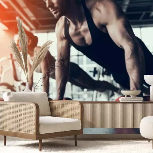 Fotobehang Een vrouw en een man oefenen met halters