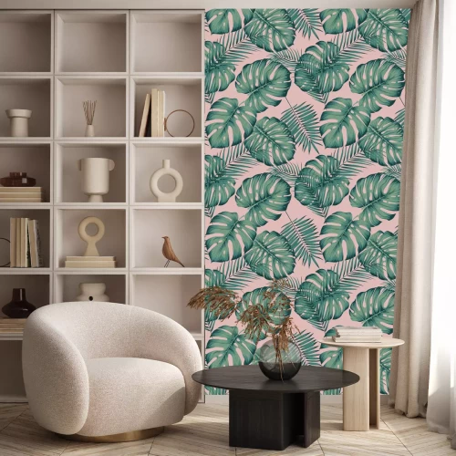 Behang Tropische bladeren op een roze achtergrond