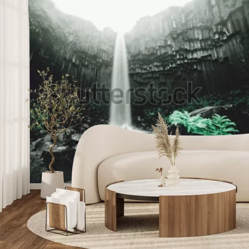Fotobehang Waterval in een grot met groene planten
