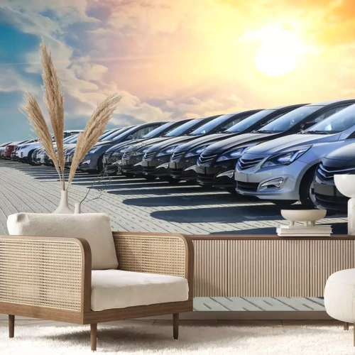 Sticker Een rij geparkeerde auto's onder de ondergaande zon