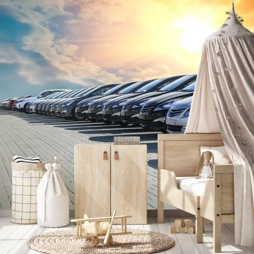 Sticker Een rij geparkeerde auto's onder de ondergaande zon