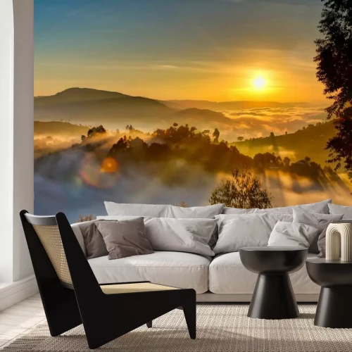 Fotobehang Bergen in de mist bij zonsopgang