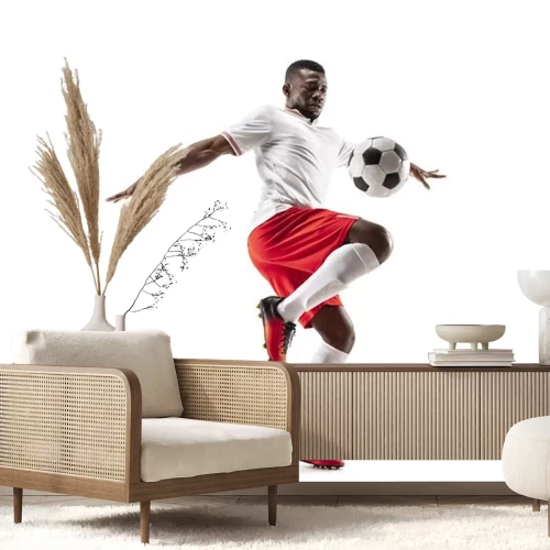 Sticker Zwarte voetballer schopt de bal met zijn knie