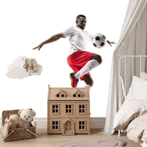 Sticker Zwarte voetballer schopt de bal met zijn knie