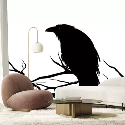 Sticker ominous raven sitting on a bare tree branch - black crow bird halloween theme vector silhouette design