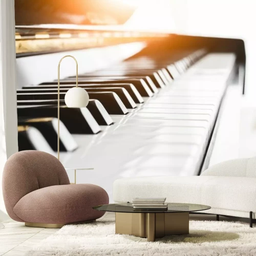 Fotobehang Pianotoetsen in het licht van de ondergaande zon
