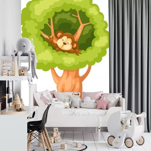 Sticker Een bruine aap in de kruin van een massieve boom