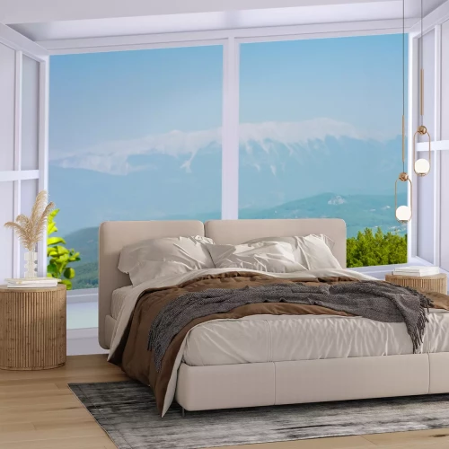 Fotobehang Uitzicht op de bergen door een open wit raam