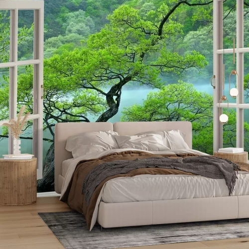 Fotobehang Uitzicht vanuit het raam op een landschap met een boom en een meer