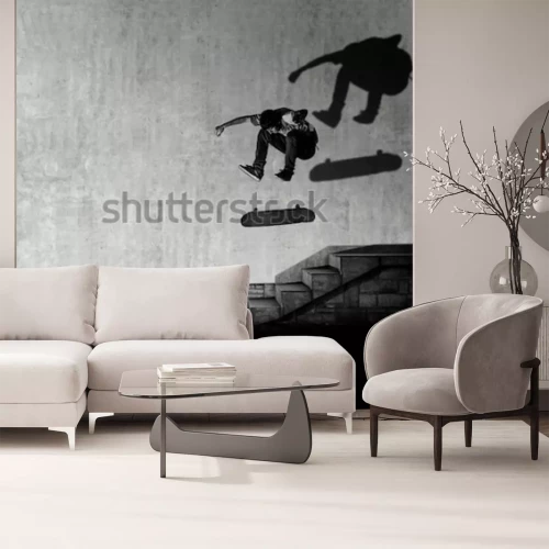 Fotobehang Een skateboarder die een trick over de trap uitvoert