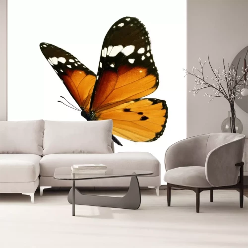 Sticker Close-up van een oranje-zwarte vlinder tijdens de vlucht