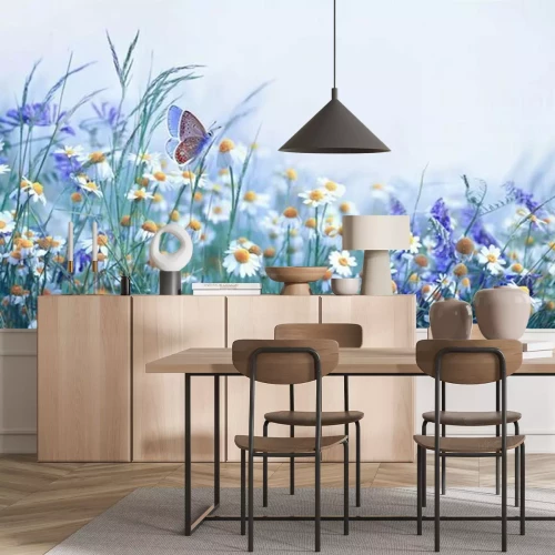 Fotobehang Lenteweide met bloeiende kamille