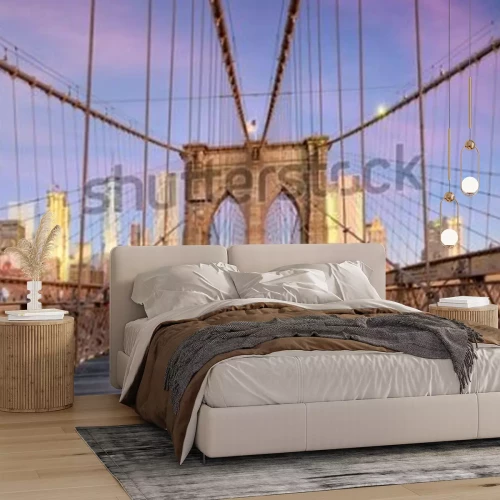 Fotobehang New York, New York on the Brooklyn Bridge Promenade facing Manhattan's skyline at dawn.