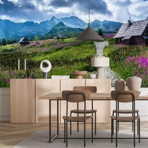 Fotobehang Groene vlakte met bergen op de achtergrond