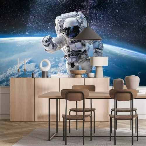 Fotobehang Astronaut boven de planeet Aarde