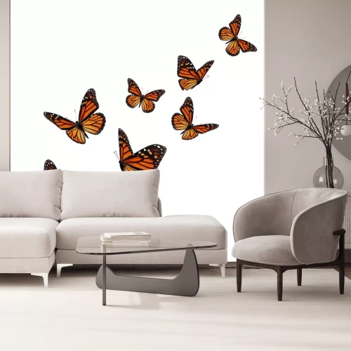Sticker Oranje-zwarte vlinders die vliegen