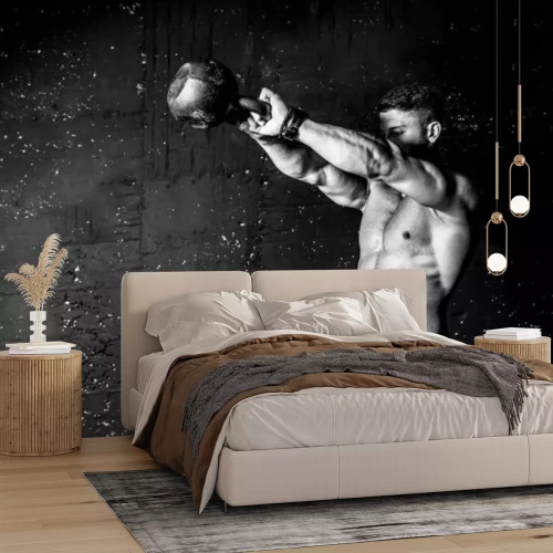 Fotobehang Kettlebell-krachttraining voor een gespierde man