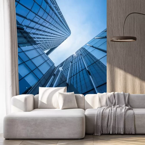 Sticker Wolkenkrabbers op de achtergrond van blauwe hemel