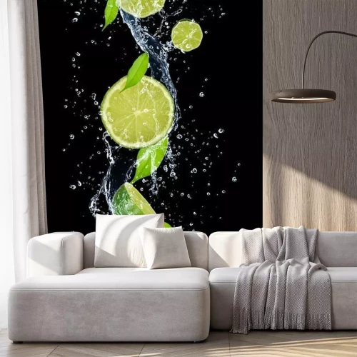 Sticker Limoenen in water op een zwarte achtergrond