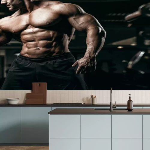 Fotobehang Een bodybuilder tijdens intensieve krachttraining
