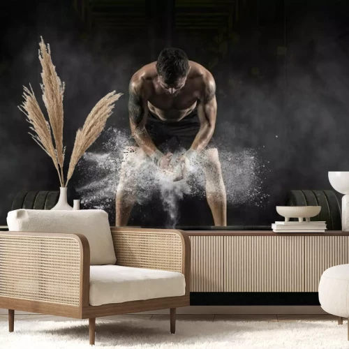 Fotobehang Een man bereidt zich voor om te gaan sporten in de sportschool