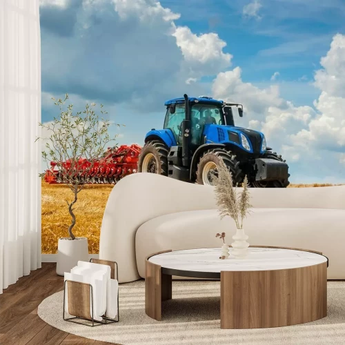 Fotobehang Blue new tractor with red harrow in the field against a cloudy sky, agricultural machinery work