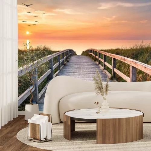 Fotobehang Een steiger over de zee in het licht van de zonsopgang