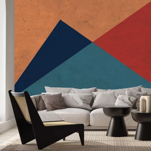 Fotobehang Ongelijkzijdige driehoeken met overheersend oranje tinten op betonnen achtergrond