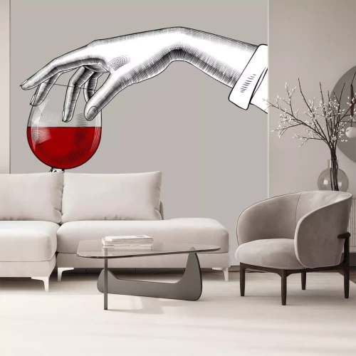 Sticker Woman's hand holding a glass with red wine