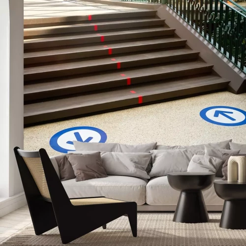 Sticker Epidemic protection measures in shops, shopping malls or centres floor blue circle stickers with arrow . Social Distance Shopping. Life after virus. Secure marking of lines on floor for directions,