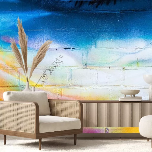 Sticker A fragment of colorful graffiti painted on a brick wall. Abstract backdrop for design.